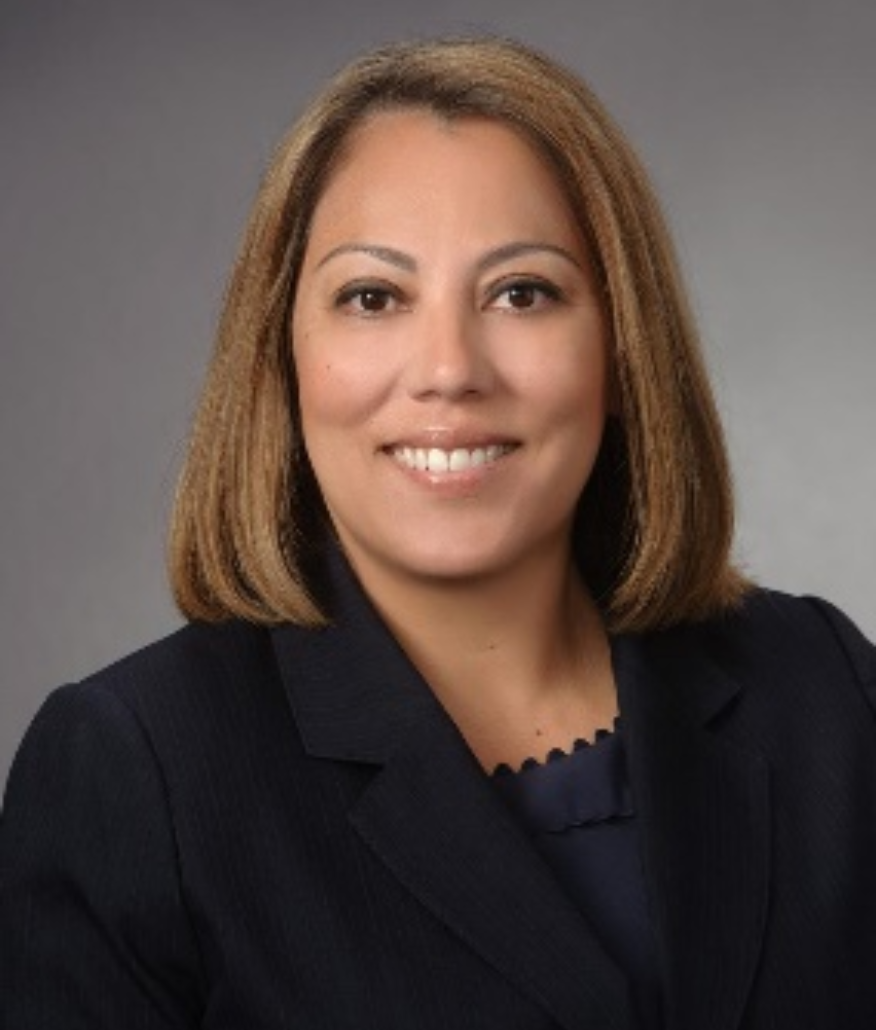 Sandra, a Visions board member, smiles for a professional portrait