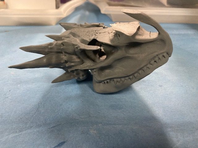 Gray miniature dragon skull model