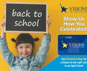 Young girl smiles and holds up a chalkboard sign that says "Back to School" on it