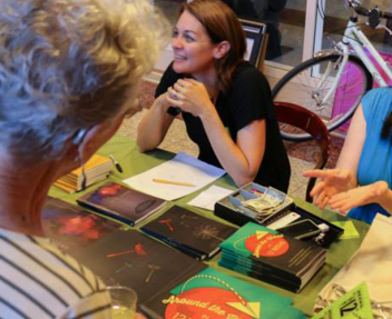 Students and teachers meeting family and friends at book party