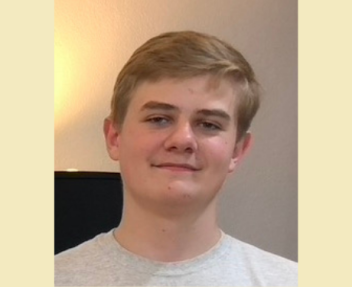 Home school student smiles at the camera