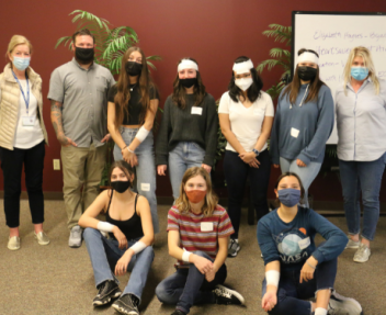 Students participated in activities including mock-bandaging and CPR chest compressions on dummies under the supervision of trained CPR professionals