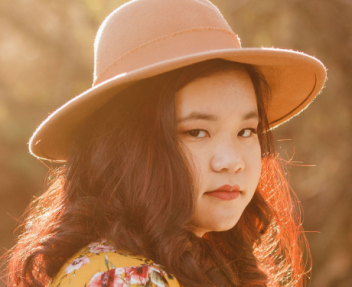 Tia K. homeschool graduate smiles at the camera