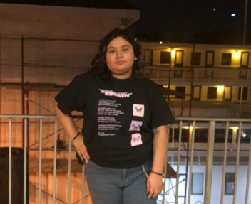 Female online high school student posing by the river for student spotlight article