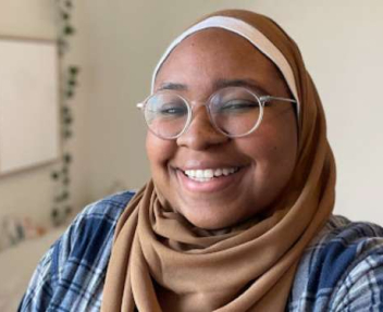 smiling online high school student who loves science