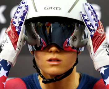 Image of Olympic Snowboarder adjusting her helmet